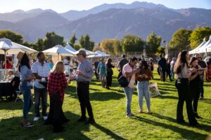 Palm Springs wine festival guests standing outdoors drinking wine.